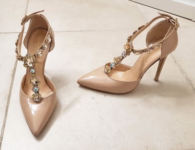 A) Jewel heels in patent nude color<br />.
