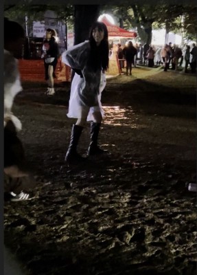 This lady with her friends were screaming in disgust as they walked through the mud.